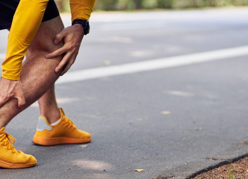 Man dealing with achilles tendon injuries on a jog