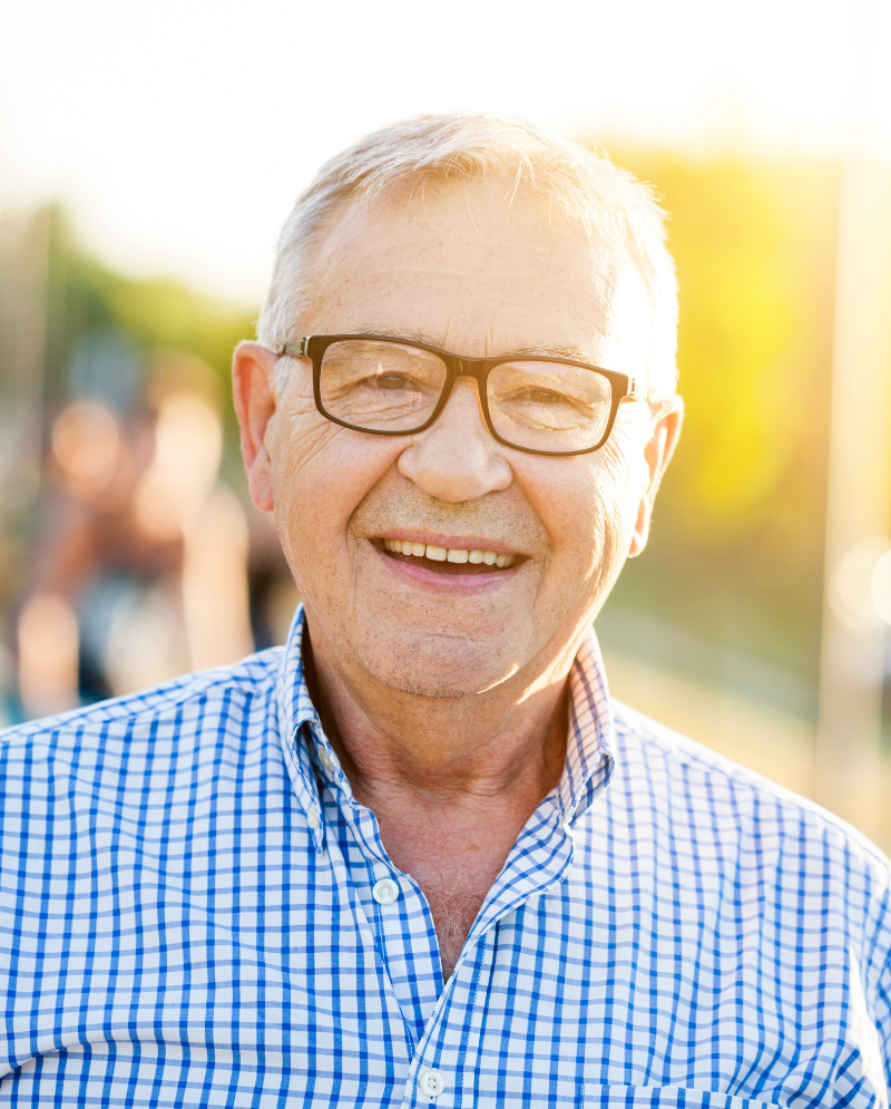 Smiling older man wearing glasses
