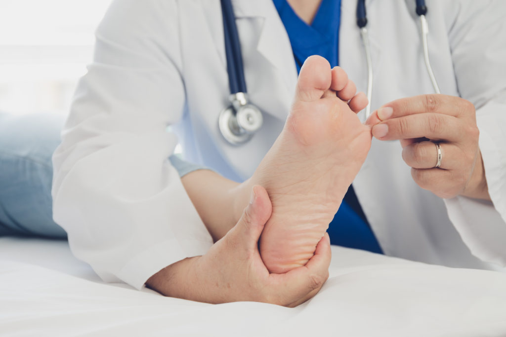 Doctor examining a patient's foot